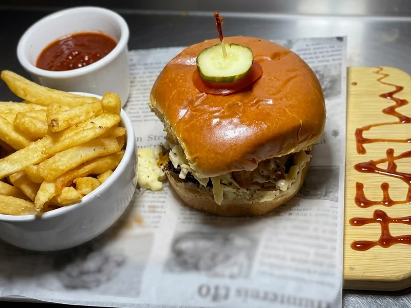 Spicy Lagos Heat-Wave chicken burger with fries at Lagos Flavors in Queen Mary Park, Edmonton, AB
